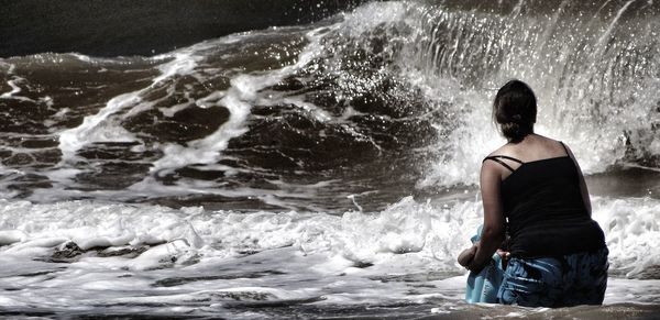 Woman standing on rocks