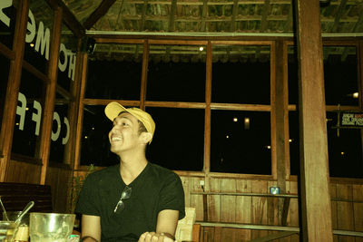 Mid section of man sitting at restaurant table