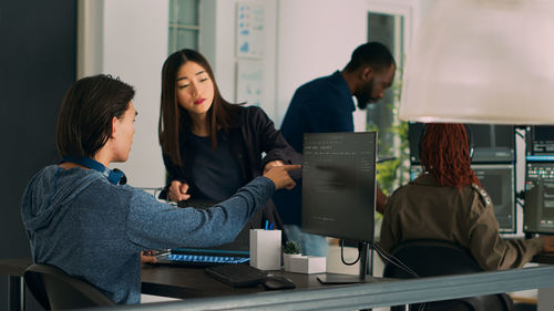 Young woman using laptop at office