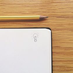 Close-up of pencil on wooden table