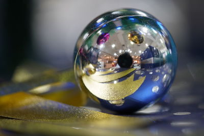 Close-up of crystal ball on table