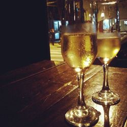 Close-up of wine glasses on table