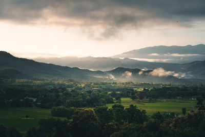 Aerial view of mountains against sky during sunset