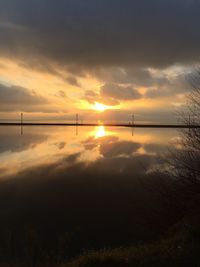 Scenic view of sunset over river