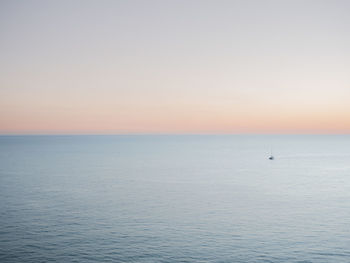 Scenic view of sea against clear sky during sunset