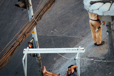 Low section of men working at construction site