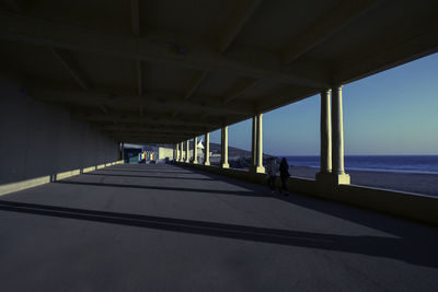 Interior of bridge over sea against sky