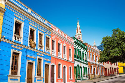 Colorful buildings against clear blue sky at la candelaria