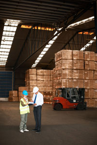 Business colleagues working in warehouse
