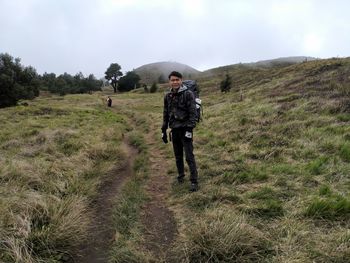 Portrait of man standing on land