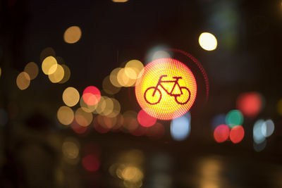 Defocused image of illuminated christmas lights at night