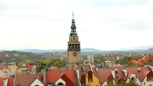 View of clock tower with cityscape in background