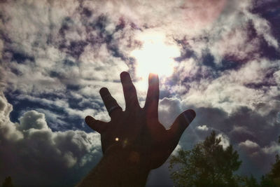 Low angle view of silhouette person against sky