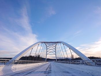 View of bridge against cloudy sky