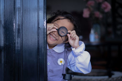 Young woman photographing through camera