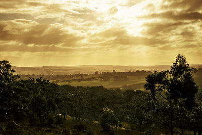 Scenic view of landscape against sky during sunset