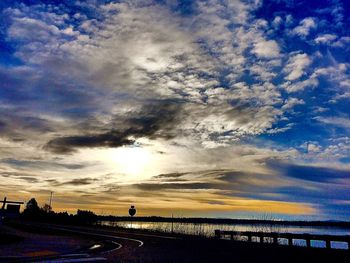 Scenic view of landscape against cloudy sky