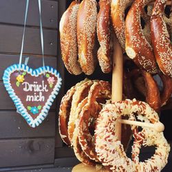 Close-up of sweet food hanging against wood