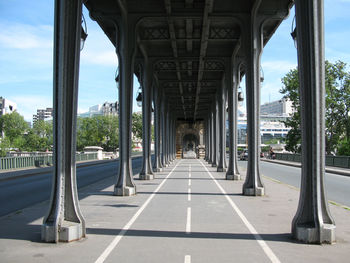 Corridor of bridge against sky