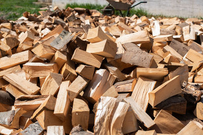 High angle view of stack of logs on field