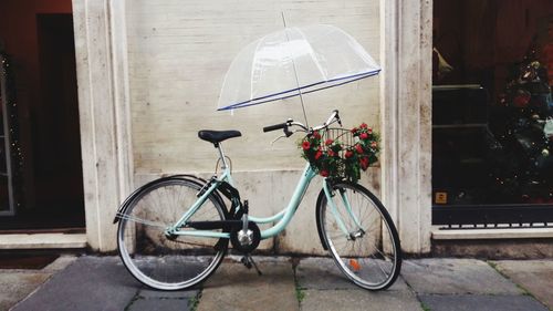 Bicycle on street against wall