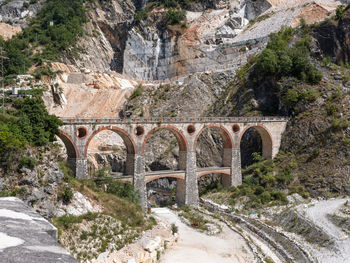 Bridge of vara in carrara, site of the old private marble railway - tuscany, italy.