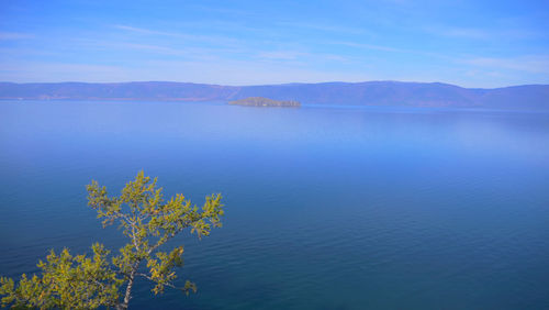 Scenic view of lake against blue sky