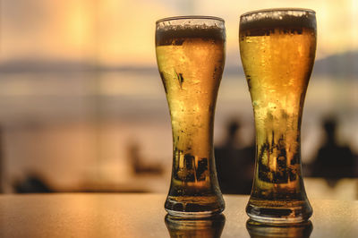 Close-up of beer glass on table