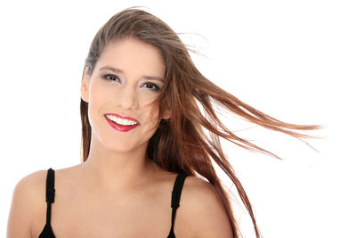 Portrait of a beautiful young woman over white background