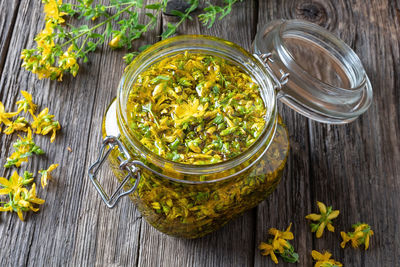 High angle view of plants in glass jar on table