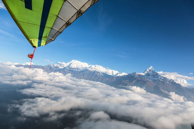 Low angle view of mountains against blue sky