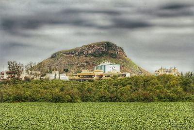 Scenic view of landscape against cloudy sky