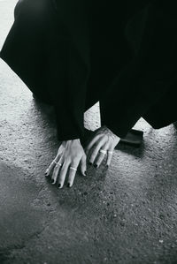 Low section of woman sitting on floor