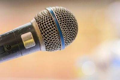 Close-up of microphone against defocused background