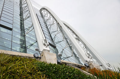 Low angle view of greenhouse against sky