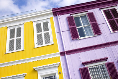 Low angle view of multi colored building against sky