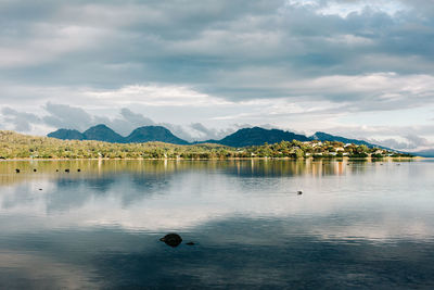 View of lake against cloudy sky