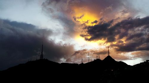 Mountain against cloudy sky