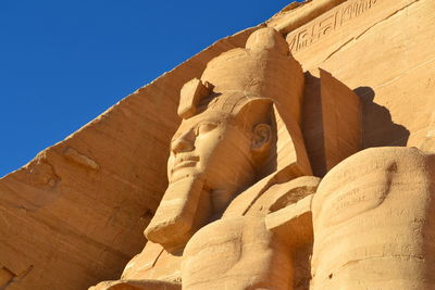 Low angle view of statue against sky