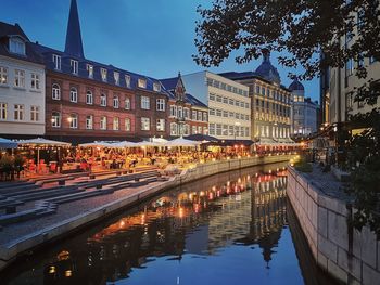 Reflection of illuminated buildings in canal