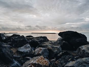 Scenic view of sea against cloudy sky