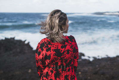 Rear view of woman looking at sea