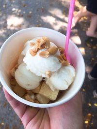 Cropped image of person holding ice cream cone