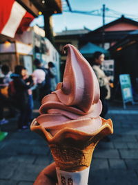 Close-up of hand holding ice cream