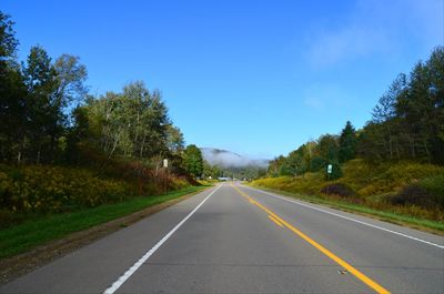 Empty country road along landscape