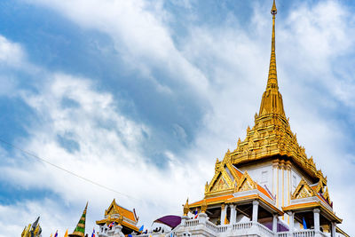 Low angle view of pagoda against buildings