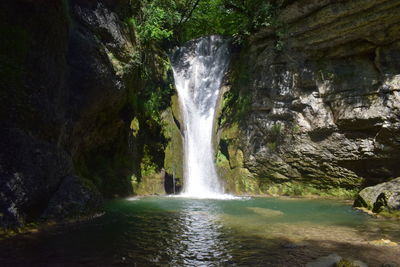 View of waterfall in forest