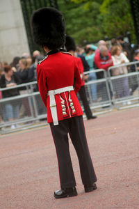 Rear view of army soldier standing outdoors