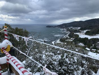 Scenic view of snow covered mountains against sky