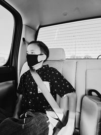 Boy sitting in car